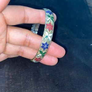 Bangle with floral hand painted designs.